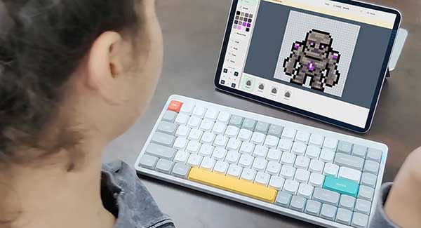 A student designing a pixel-art character